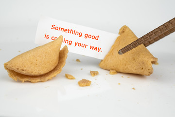 CRACKED FORTUNE COOKIE WITH WORD 