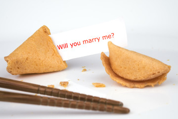 CRACKED FORTUNE COOKIE WITH WORD 