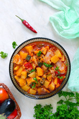 Delicious vegetable stew in a glass bowl. A popular dish of many countries of the world. Vegetarian menu. The top view
