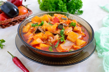 Delicious vegetable stew in a glass bowl. A popular dish of many countries of the world. Vegetarian menu