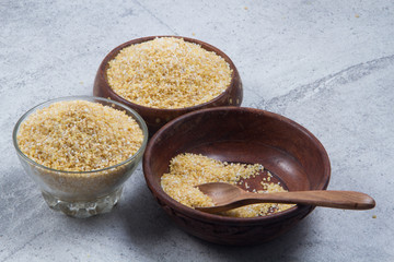 bulgur seeds isolated on texture background