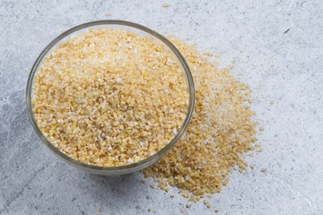 bulgur seeds isolated on texture background