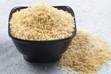 bulgur seeds isolated on texture background