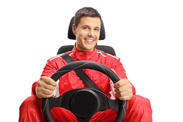 Smiling car racer holding a steering wheel