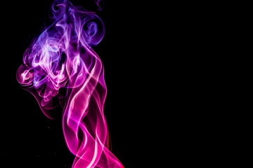 Obraz premium Colored smoke on black background