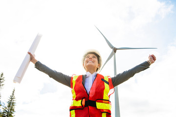 A Technician woman Engineer in Wind Turbine Power Generator Station