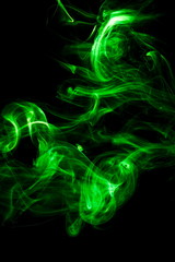 Green smoke on black background