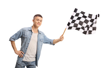 Teenager waving a checkered race flag © Ljupco Smokovski