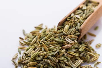 essential oil of fennel seeds on a white background
