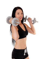 Woman workout whit two dumbbells smiling