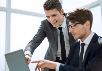 employees use a laptop to check the information they need