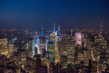 View of the night city and glowing skyscrapers from a height. New York. USA.
