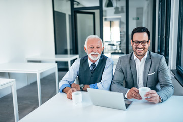 Portrait of two elegant business men.