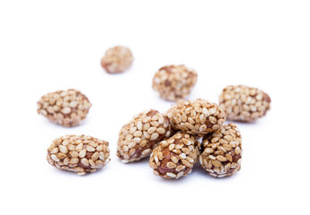 Coated peanuts with sesame isolated on white background