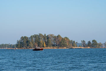 Fototapeta na wymiar Boat on the autumn sea