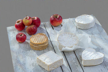 Tasting Norman cheese. French AOC soft pudgent wrapped Livarot ,Camembert, Pont-Leveque,...