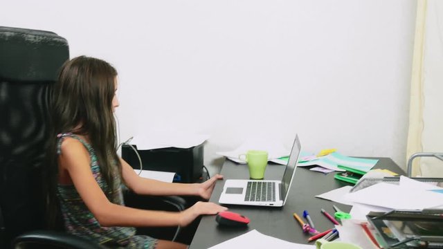 the girl poured tea on the laptop. doing homework, online learning, 4k close-ups,