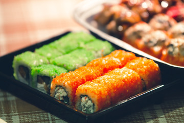 Sushi Roll with salmon, eel, avocado, cheese Philadelphia, caviar tobica. Sushi menu. Japanese food