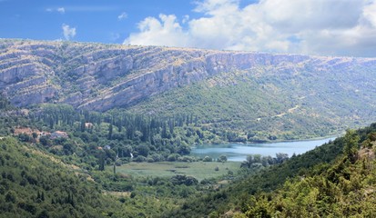 Fototapeta na wymiar lake Visovac and mountains in N.P. KRKA, Croatia