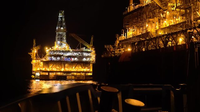FPSO tanker vessel near Oil platform Rig. Offshore oil and gas industry, sea oil production and storage