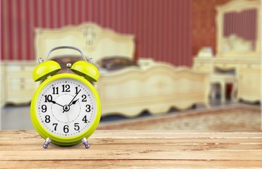 Blue Retro alarm clock on wooden table