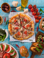 Italian food ingredients on old wooden background