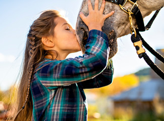 in a beautiful Autumn season of a young girl and horse - Powered by Adobe