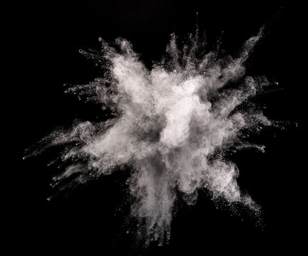 Silver powder explosion on black background.
