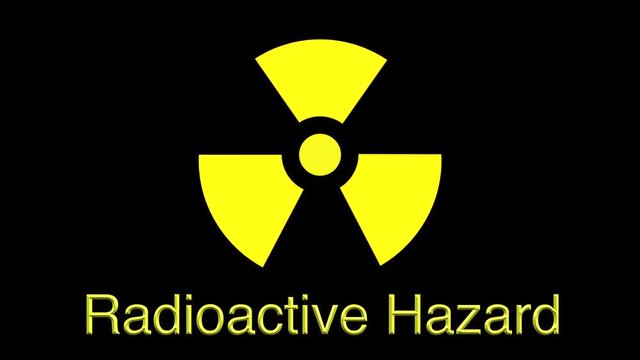 Flashing radioactive warning symbol with written warning beneath - seamless looping. 