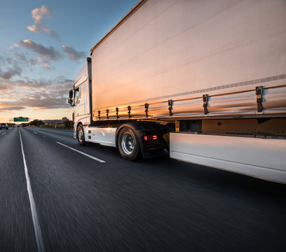 Truck with container on road, cargo transportation concept.