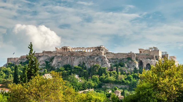 Time lapse video of Acropolis in Athens, Greece. White clouds move fast acros the blue sky. 
