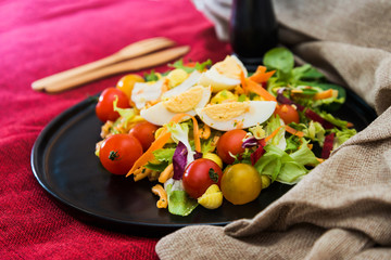 Fresh salad - Delicious fresh salad with tomatoes, lettuce, eggplant, zucchini, cheese, parma ham and olive oil.