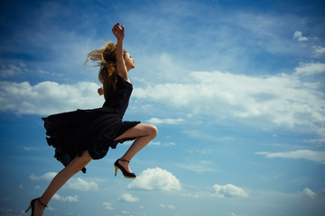 Beauty and fashion style. Free and happy. Future success. Girl on blue sky. Woman with fashion...