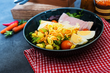 Fresh fruits salad and ham with egg