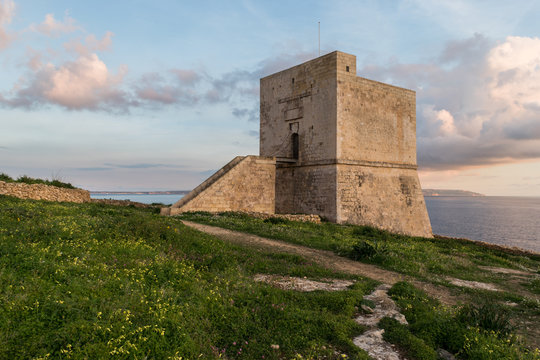 Mgarr Ix-Xini Bay Tower Gozo. Malta. Horizontal at sunset