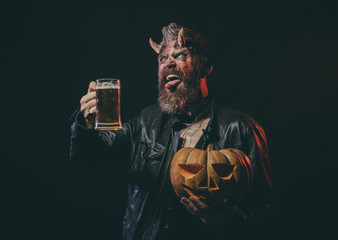 Halloween devil with glass mug show tongue