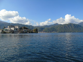 Fototapeta premium Amazing trip in Piemonte with an incredible view to the lake D'orta in autumn days and a caption of some old part of the countryside