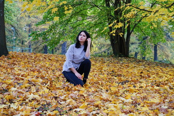 beautiful woman in autumn park