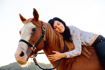 Obraz premium A Woman with her horse at sunset, autumn outdoors scene