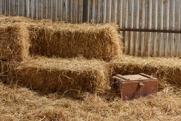 hay stacks in barn house with zinc wall © bennnn
