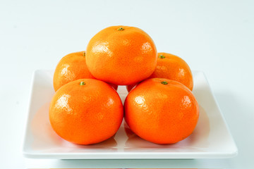 orange on white dish.