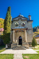 Fototapeta na wymiar Stanisoara monastery in Cozia National Park. Autumn in Cozia, Carpathian Mountains, Romania.
