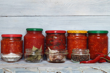 Glass jars with tinned vegetables and tomatoes