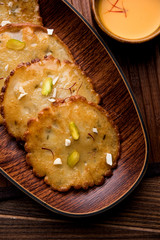 Malpua sweet - Traditional Indian dessert or pancake for festivals, served in plate with rabri/rabdi . selective focus