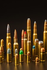 Different types of ammunition on a black background. Sale of weapons and ammunition. The right to...