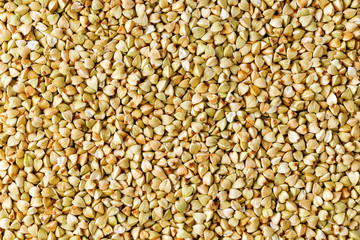 raw green buckwheat background, organic vegan food. Texture