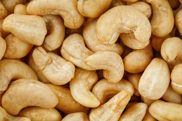 Cashew with no shell on a background. Macro nuts, Organic vegan food.