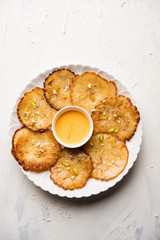 Malpua sweet - Traditional Indian dessert or pancake for festivals, served in plate with rabri/rabdi . selective focus