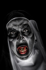 frightening evil nun with bloody teeth.