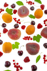 Fruit and berry background. Peach, apricot, sweet cherry, red currant and raspberry isolated on a white background.